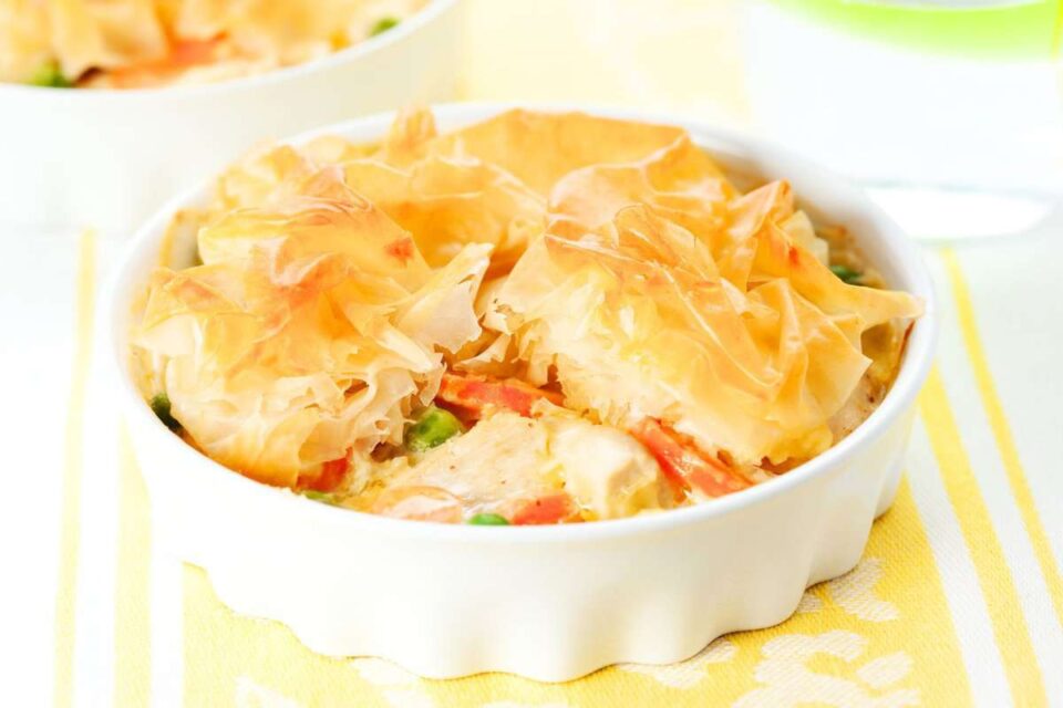 Chicken pot pie with filo dough served in individual ramekins.