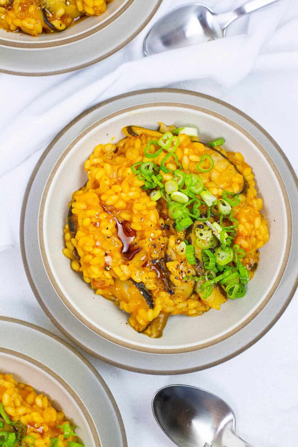 Top view of pumpkin mushroom risotto in a bowl.