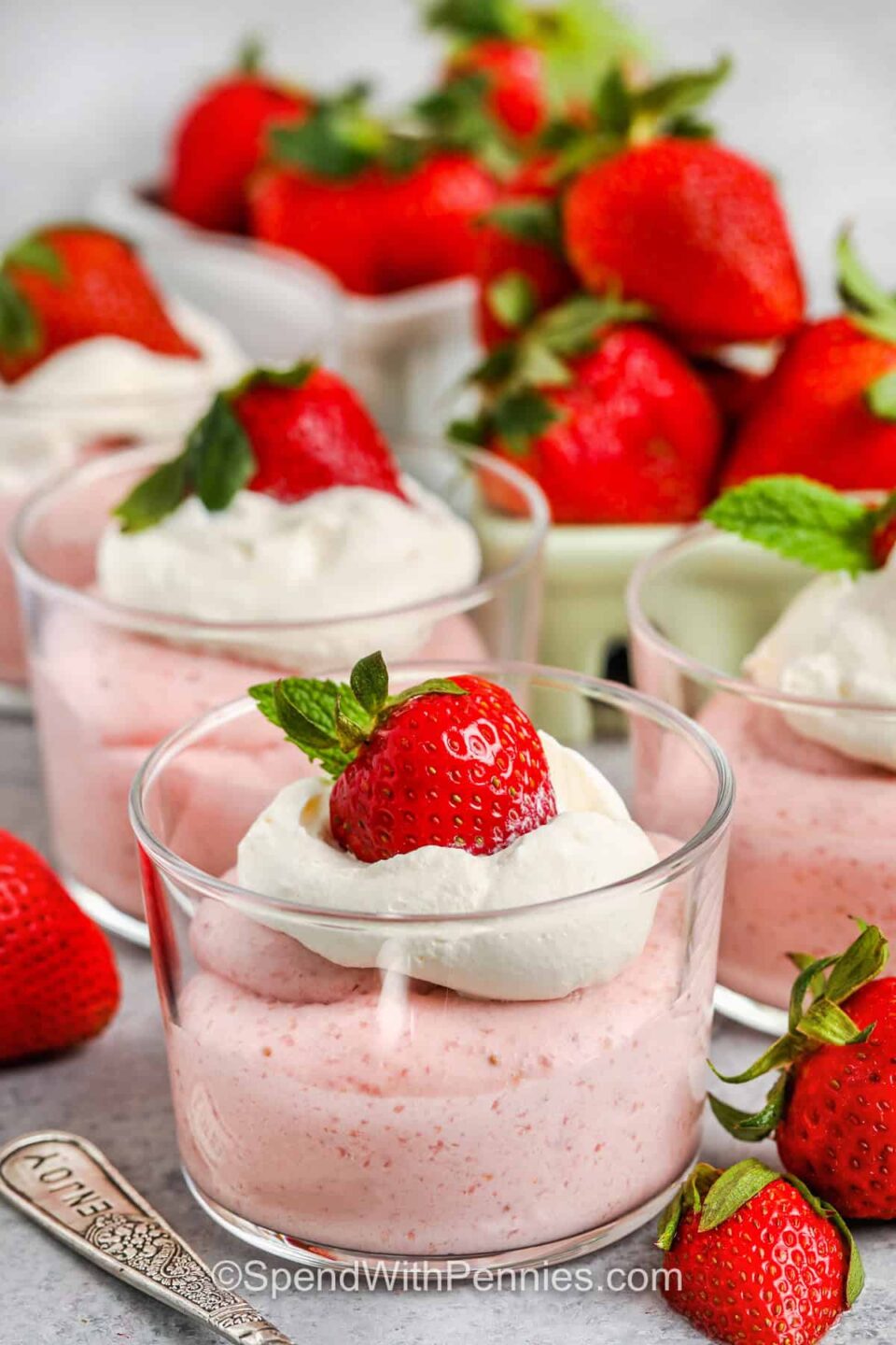 glasses of Strawberry Mousse with strawberries around it